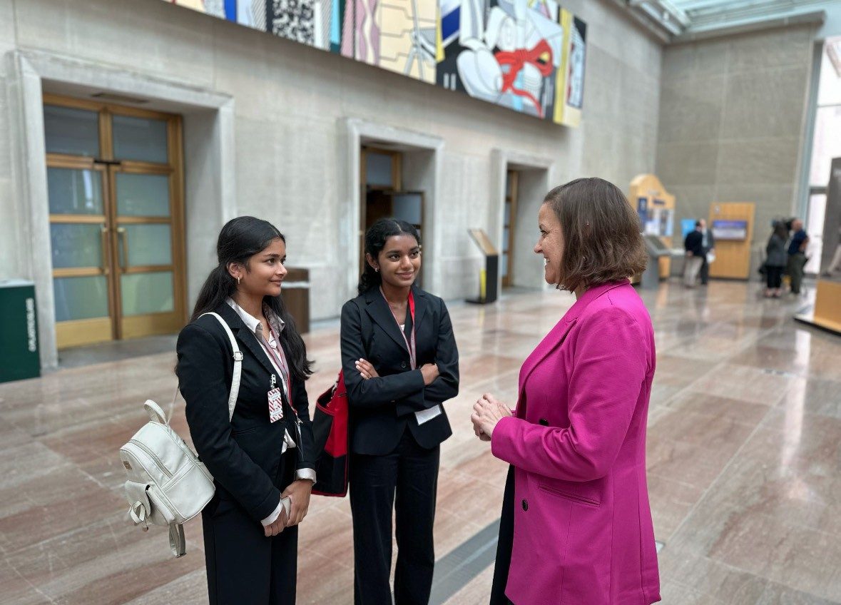 two youth action campaign members talking with a lawmaker in DC