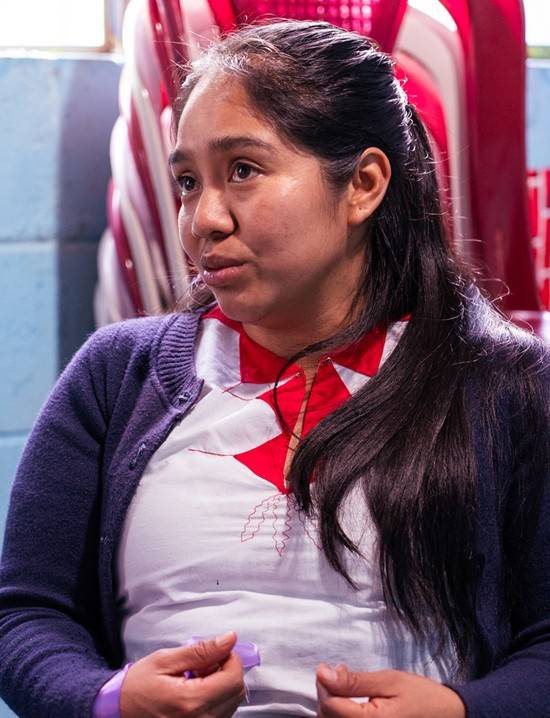 Leandra Estela Garcia is sitting in a chair being interviewed