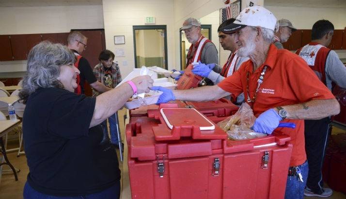 Volunteer serves a meal