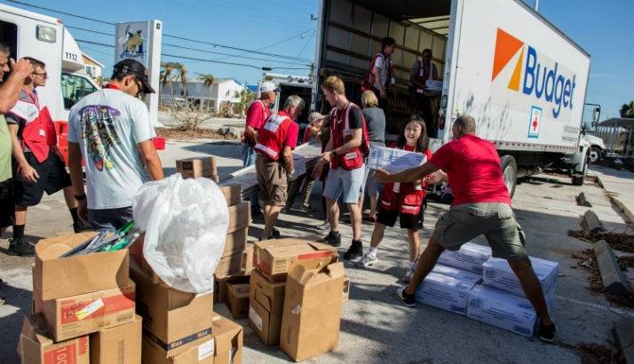 Volunteers loading meals to the truck