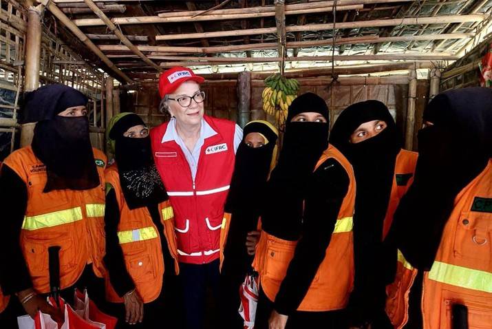 In Cox’s Bazar, Bangladesh, Kate Forbes stands with a group of women