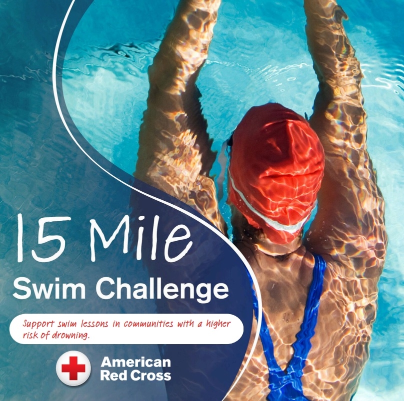 Photo of a swimmer in a pool doing laps and wearing a red swim cap and goggles