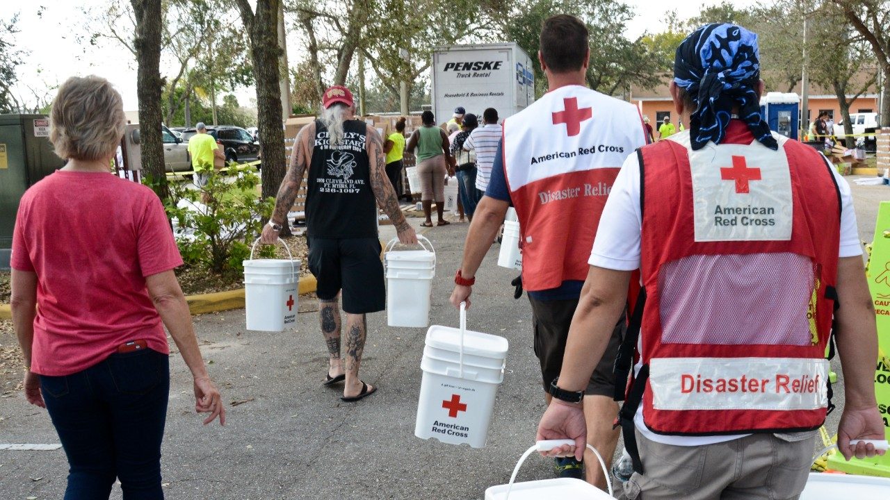 disaster volunteers walking with buckets