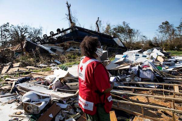 August 27, 2020.  Lake Charles, Louisiana.American Red Cross volunteer Pam Harris looks at damage caused by Hurricane Laura in Lake Charles, LA on Thursday August 27, 2020.Photo by Scott Dalton/American Red Cross