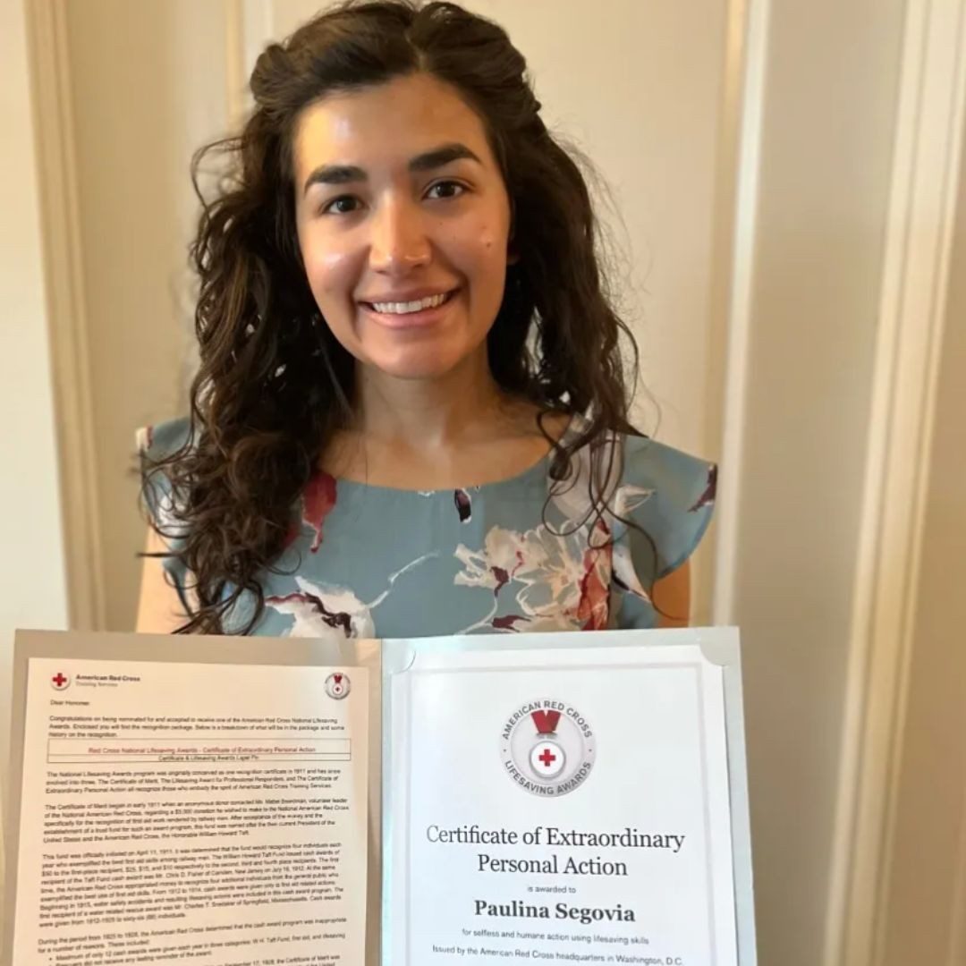 paulina holding certificate of extraordinary personal action