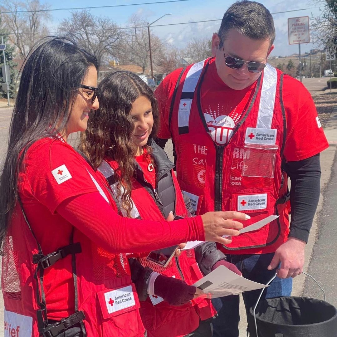 group of volunteers reviewing installments