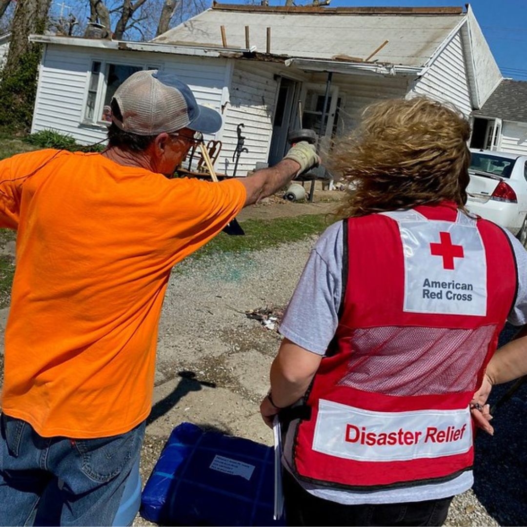 disaster responder speaking with resident