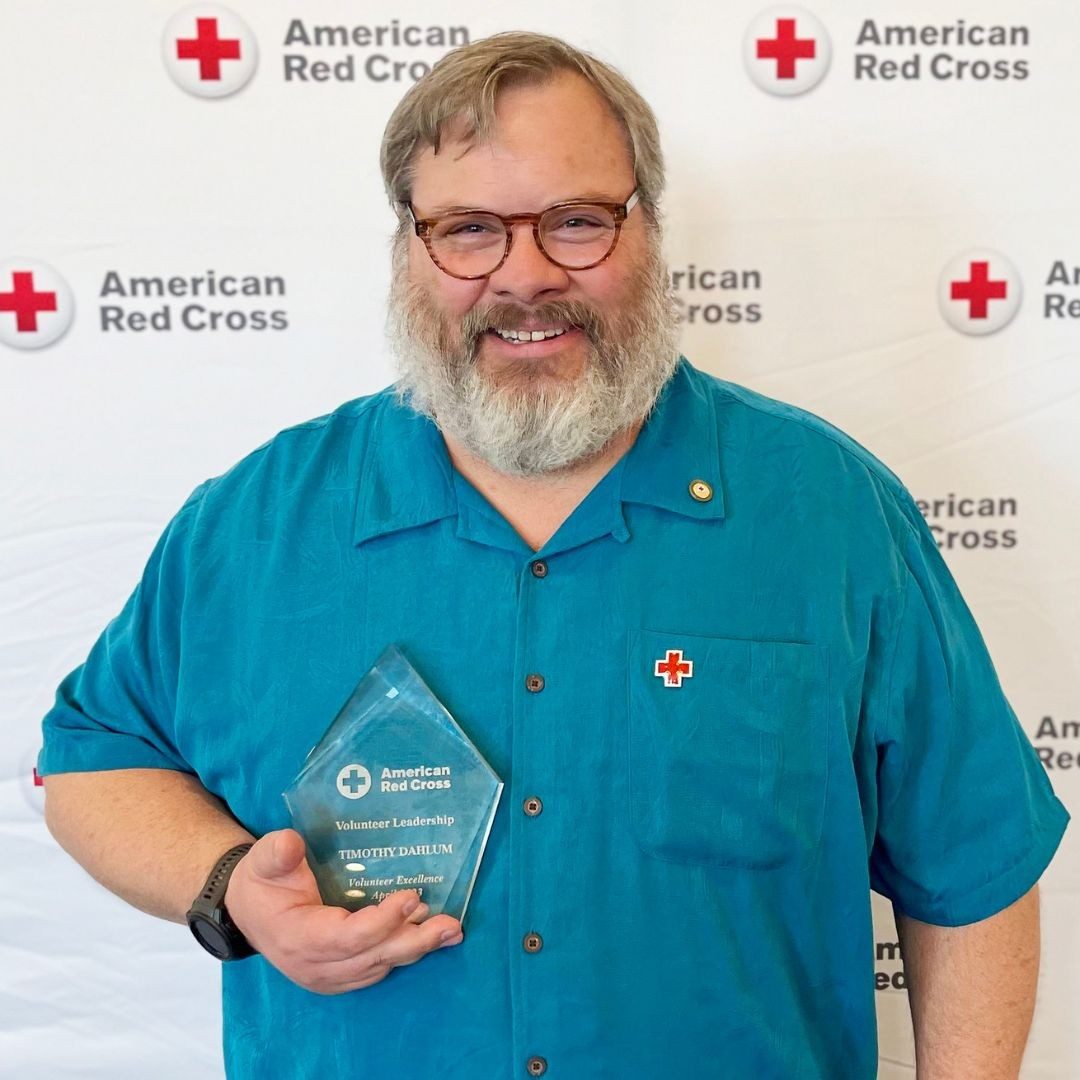 volunteer timothy darlum holding award