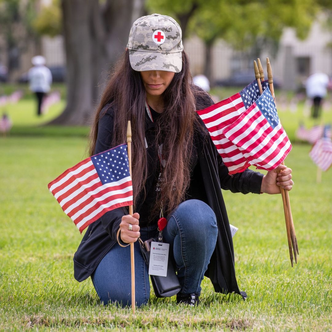 lynda palmer placing american flags in ground