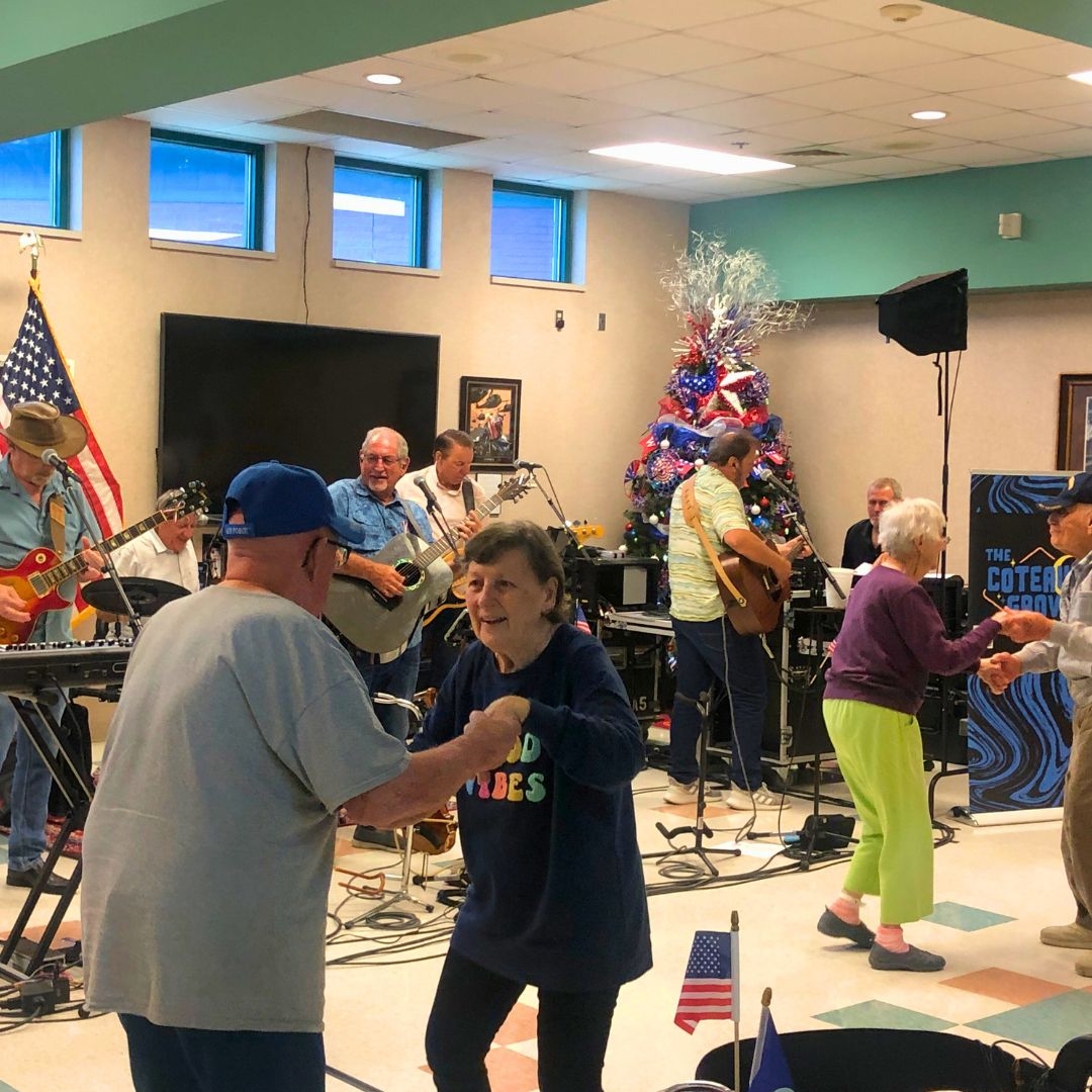 residents dancing at christmas themed party