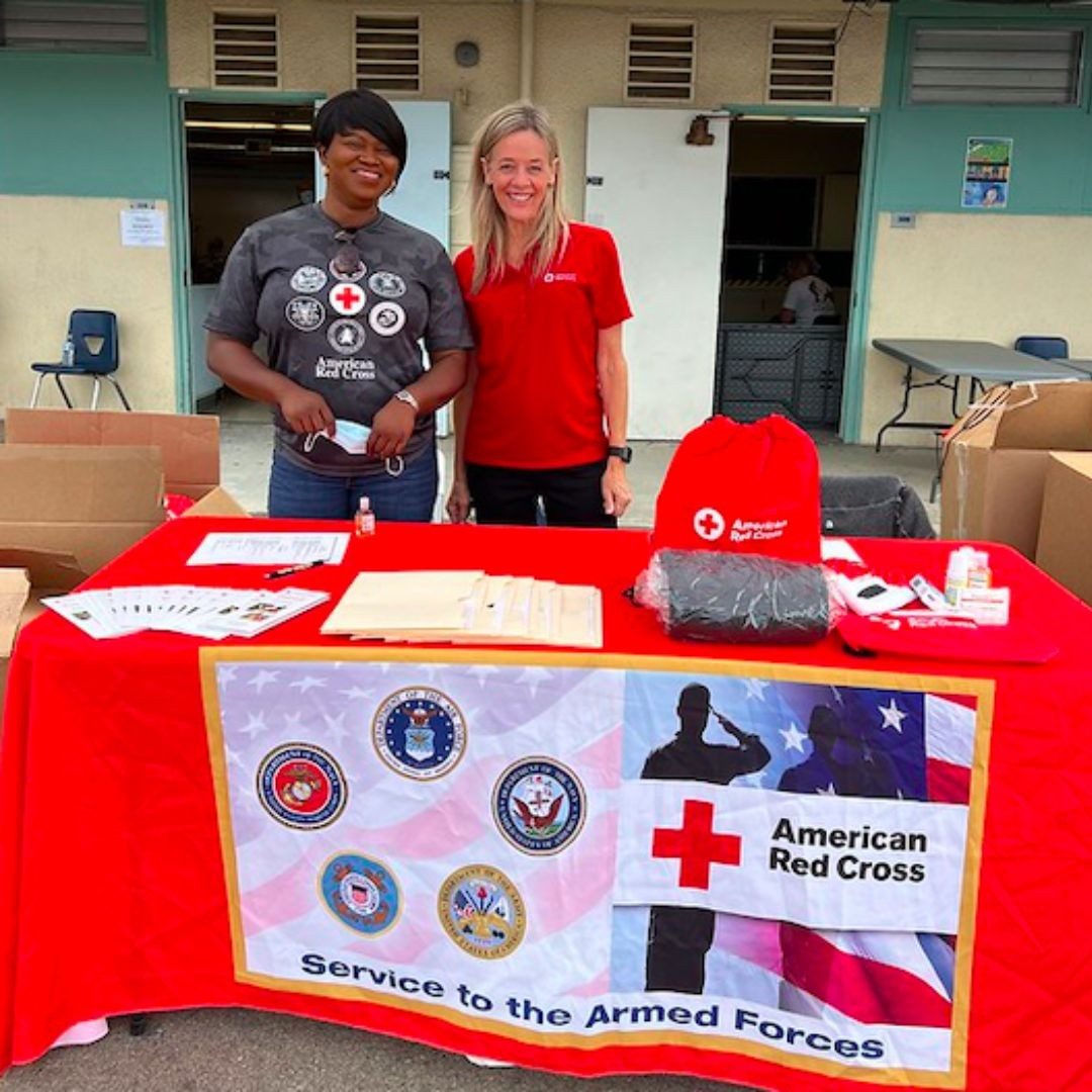 debra cox behind red cross saf table