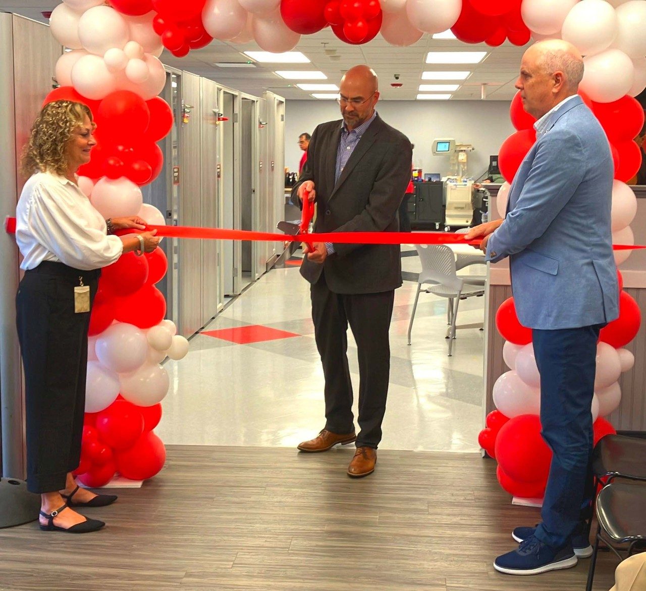 Cutting the ribbon at new blood donation center in Farmington