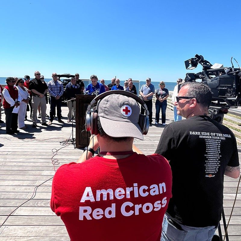 Long Island Red Cross Hurricane Preparedness Press Conference 2024 with person wearing an American Red Cross shirt and hat.