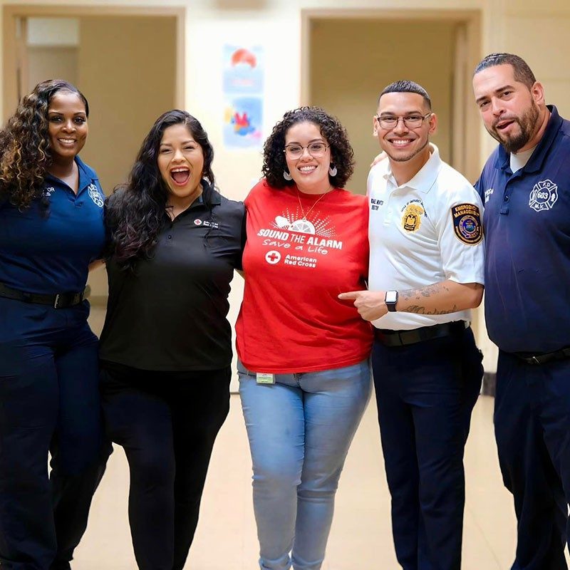 Two Mount Vernon Office of Emergency Management employees, two Fire Department employees and an American Red Cross employee take a group photo.
