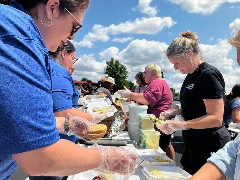 Volunteers feed communities after storms. 