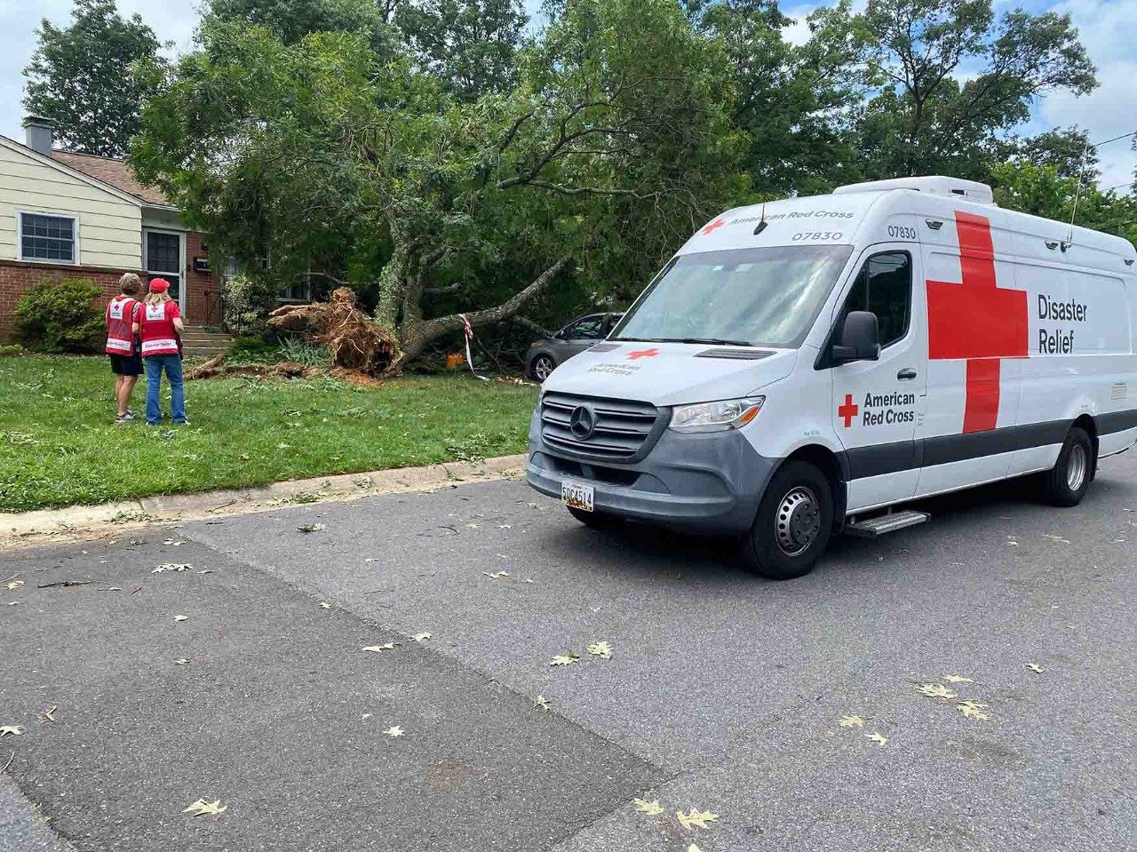 Volunteers help with recovery resources after storms.