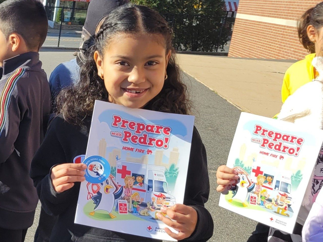 Young school children are taught fire safety
