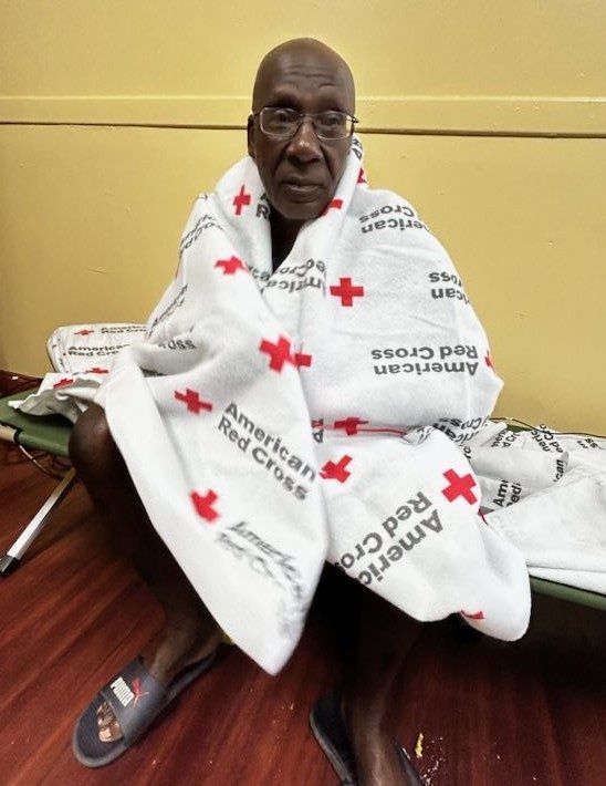 An affected community member after torrrential rain in Florida