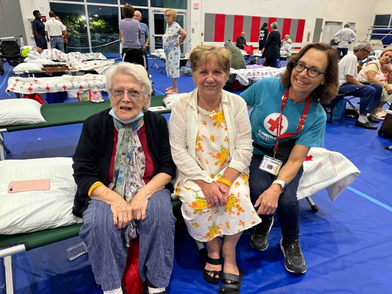 Volunteers assist displaced families after a fire in Miami