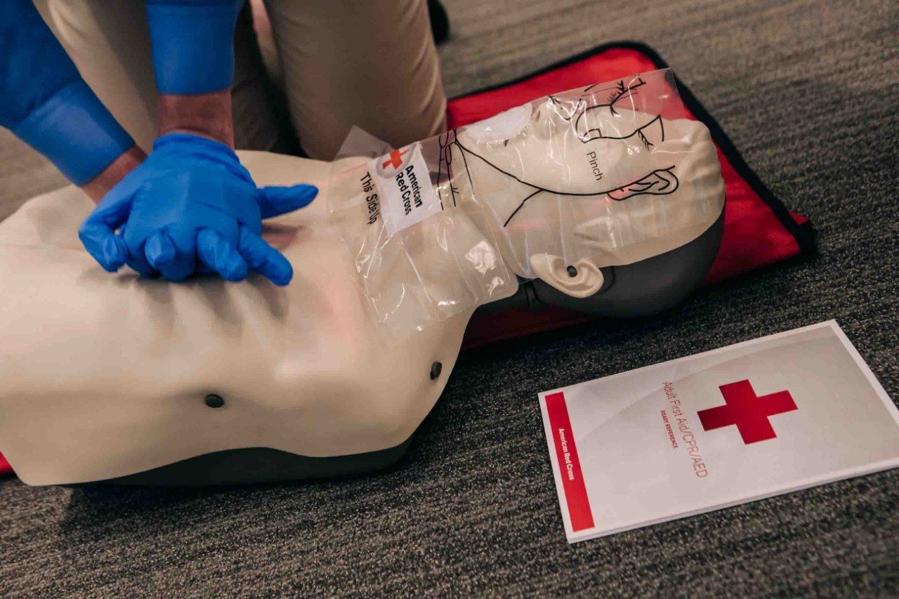Volunteer demonstrates CPR