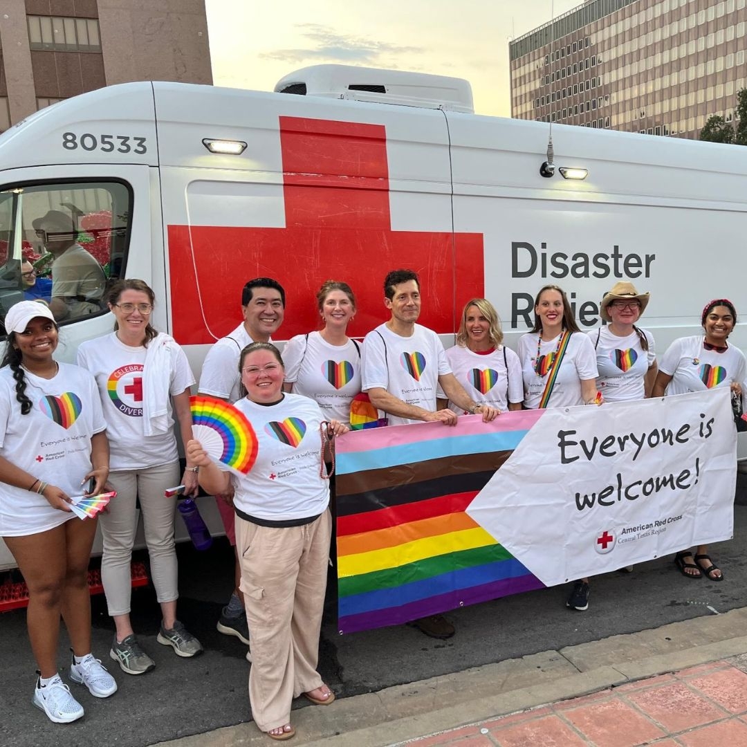 red crossers outside of vehicle at pride parade