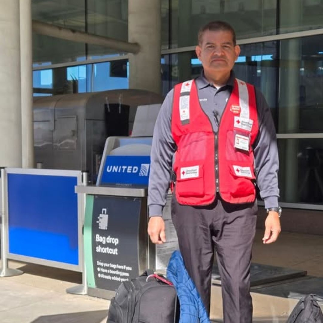 volunteer outside of airport entrance