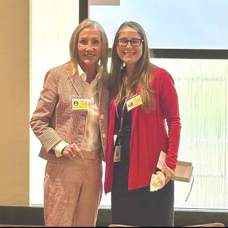 Tiffany Circle member, Marty McMahon, standing next to another Tiffany Circle member.