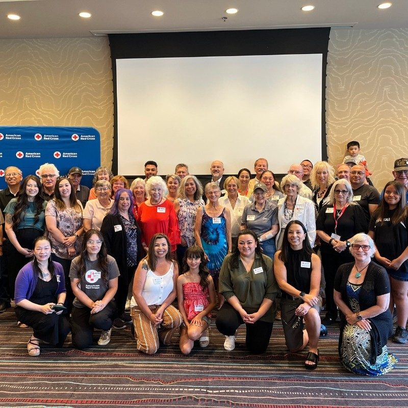 A large group of Red Cross volunteers taking a photo.