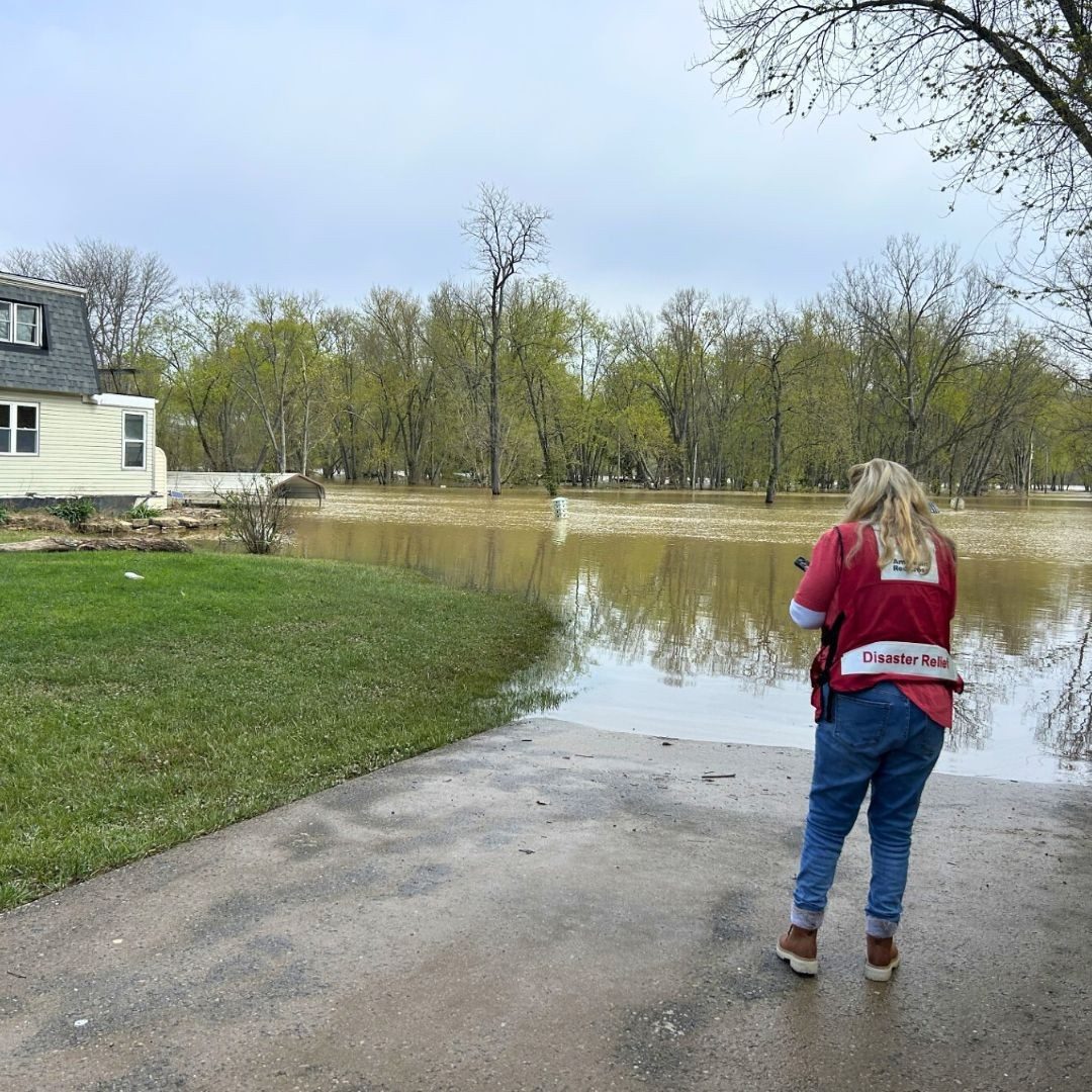 disaster relief volunteer viewing flooding damage