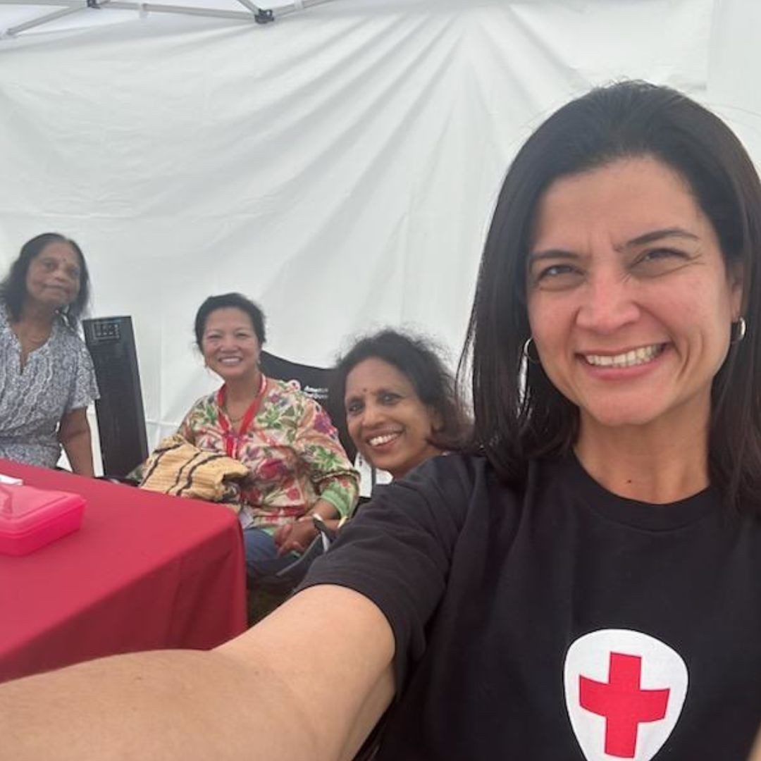 red crosser smiling with others