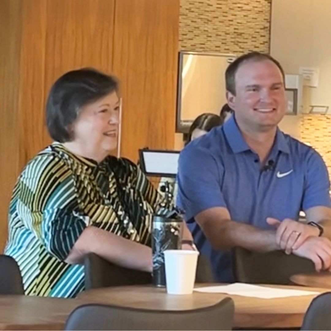 man and woman conversing