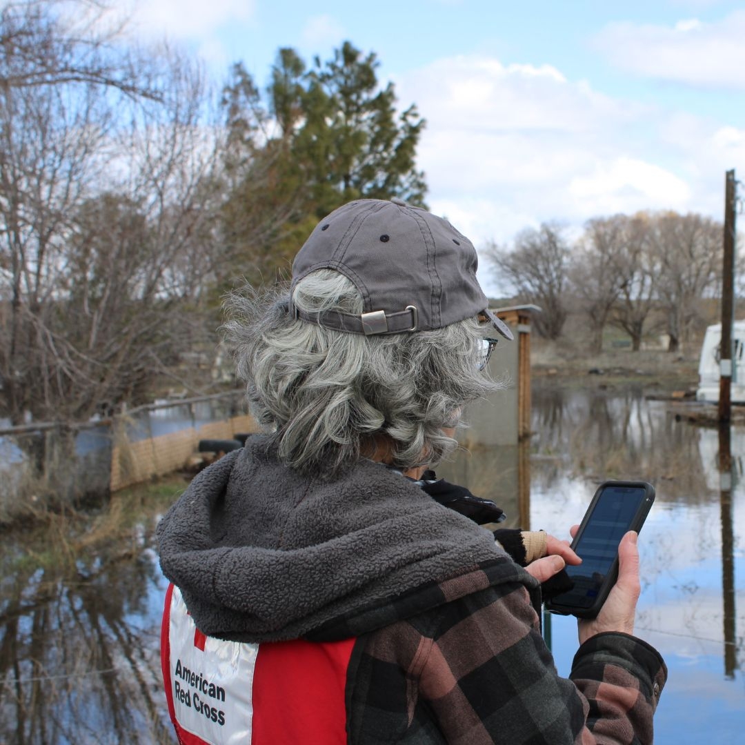 volunteer viewing flood damage
