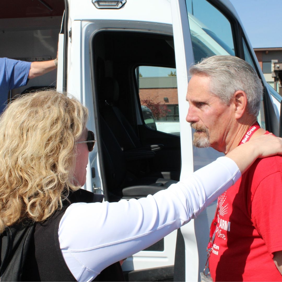 woman speaking with volunteer, jack crowell