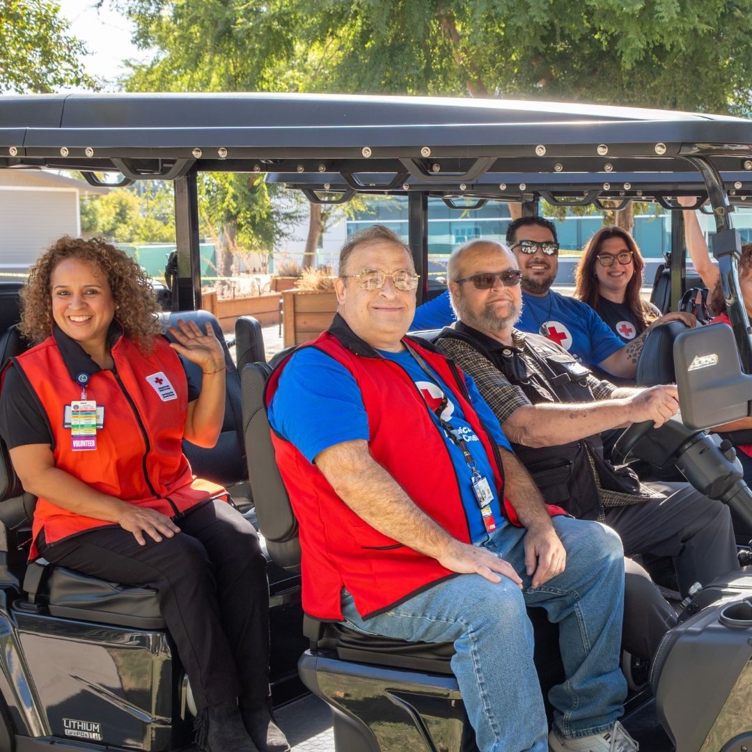 group of red crossers in shuttle cart