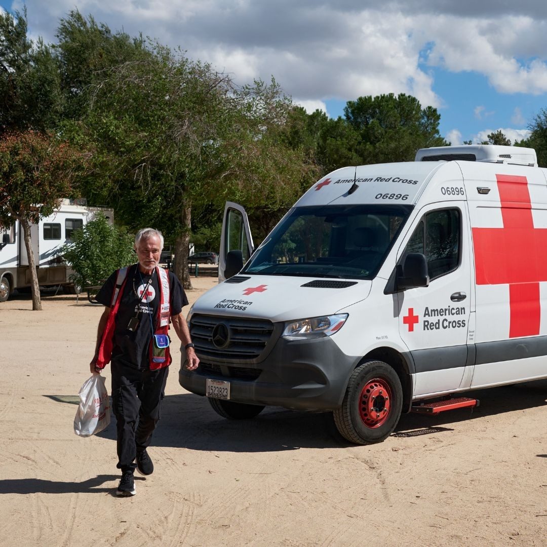 volunteer walking from disaster relief vehicle