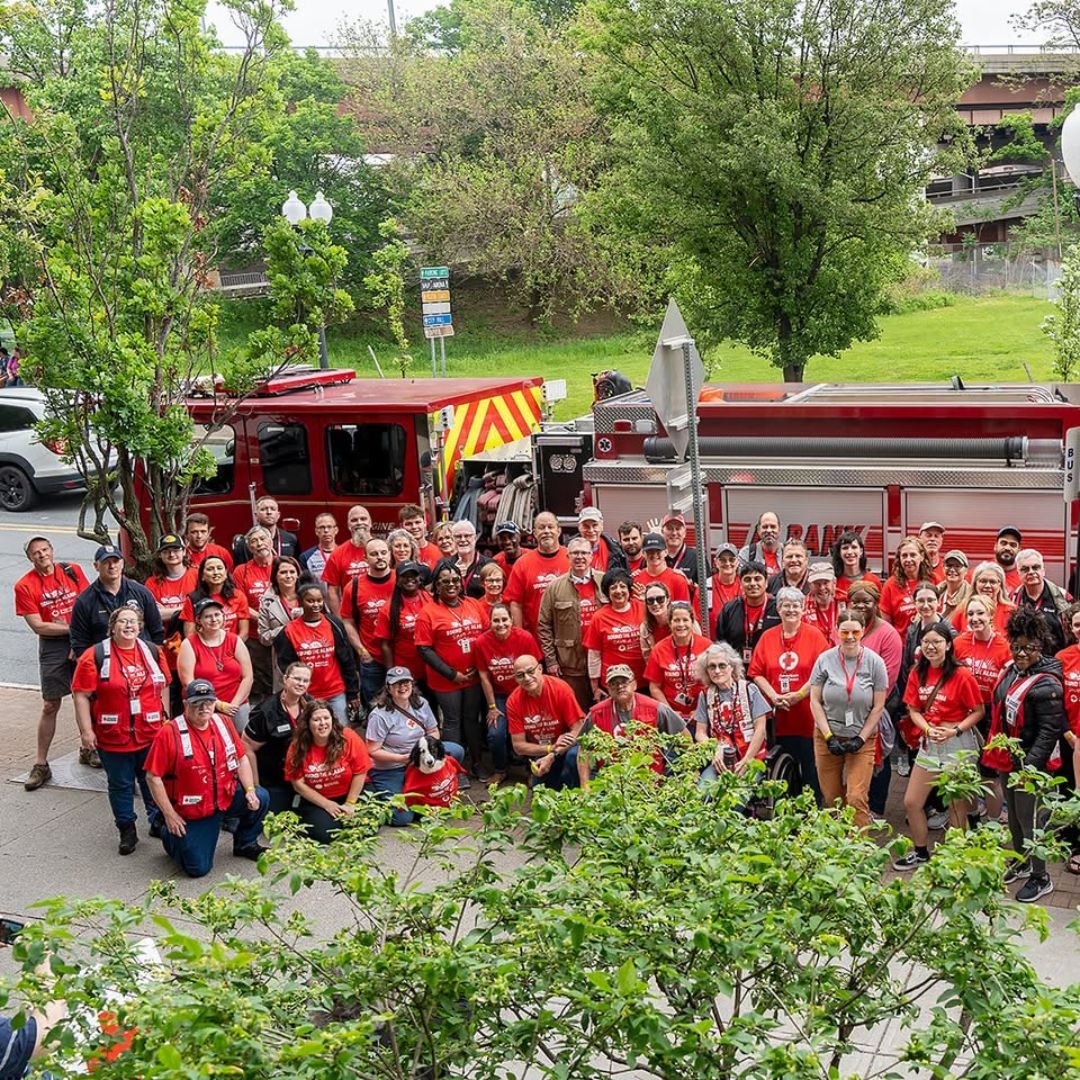 large group of sound the alarm volunteers in front of fire truck