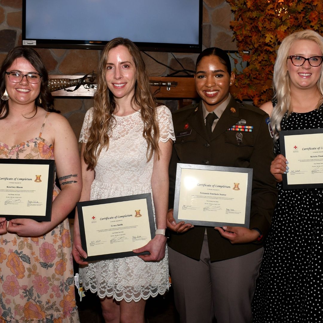 Red Cross Dental Assistant training program students standing with certificates