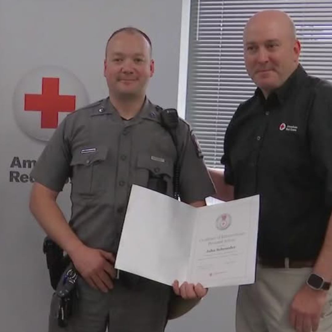 Trooper John Schroder receiving lifesaving award