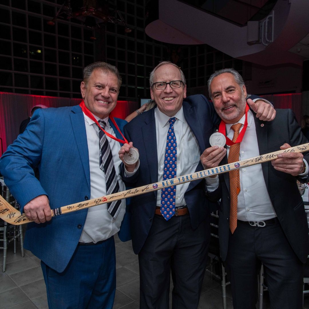three men at heroes ceremony