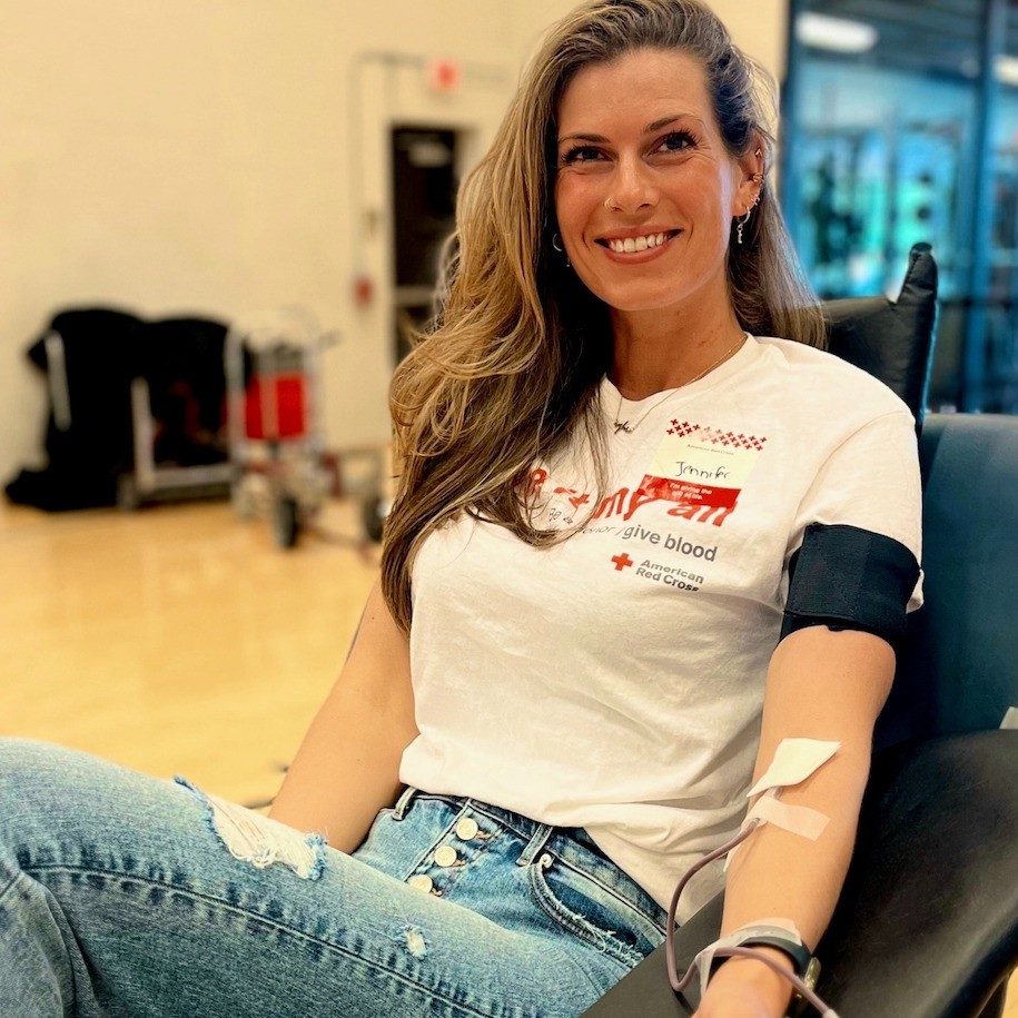 Smiling woman giving blood.