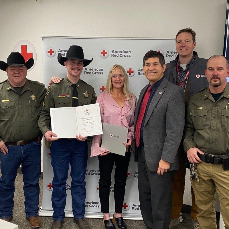 Group of Owyhee deputies and Red Cross staff posing for a picture holding awards.