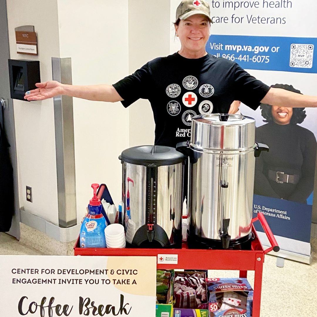 red crosser serving coffee