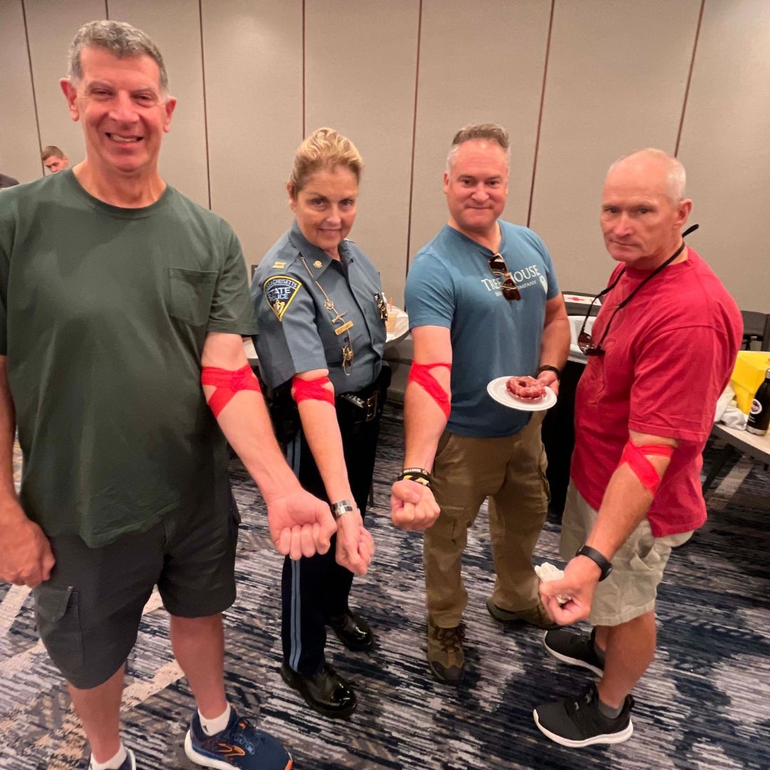 group of blood donors showing off arm