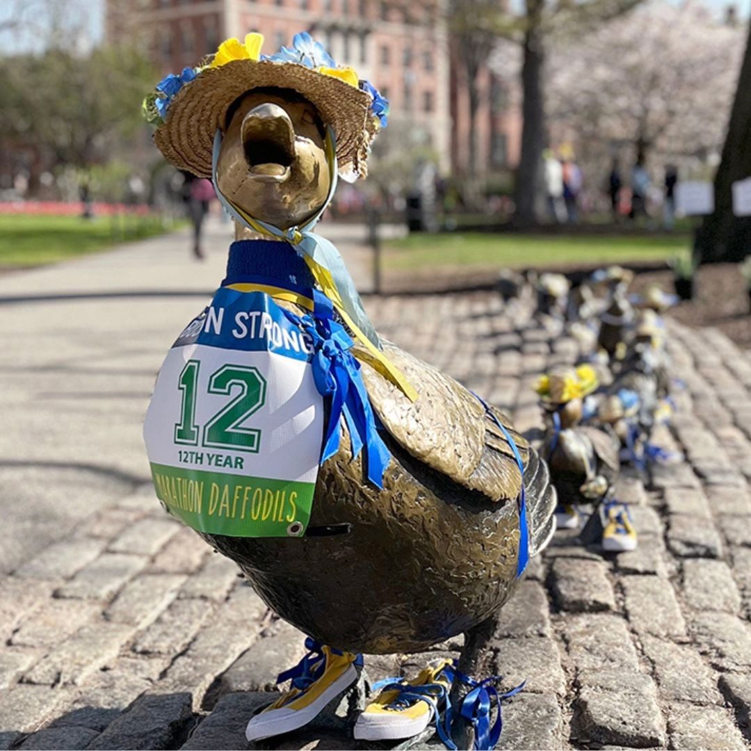 small duck sculpture decorated in marathon attire