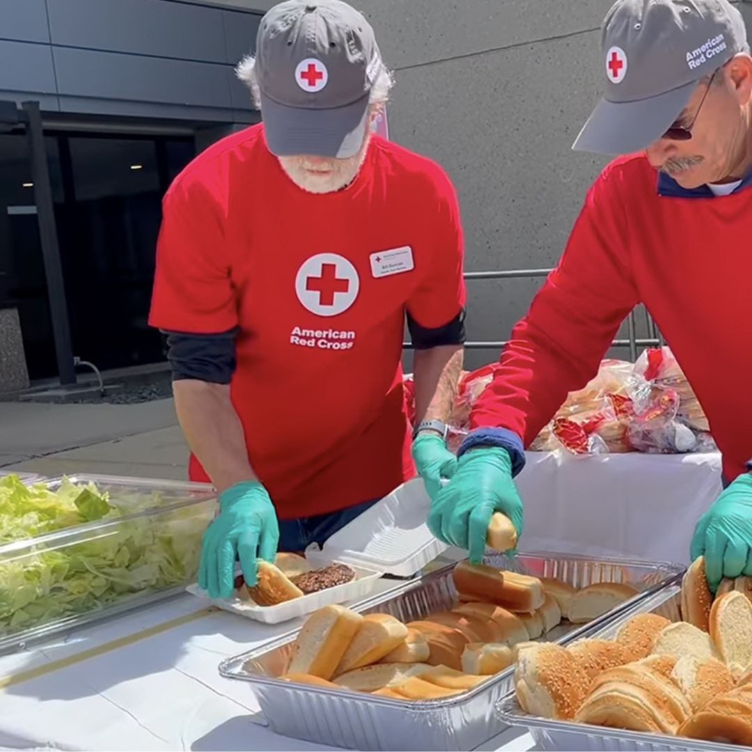 red cross volunteers handling food