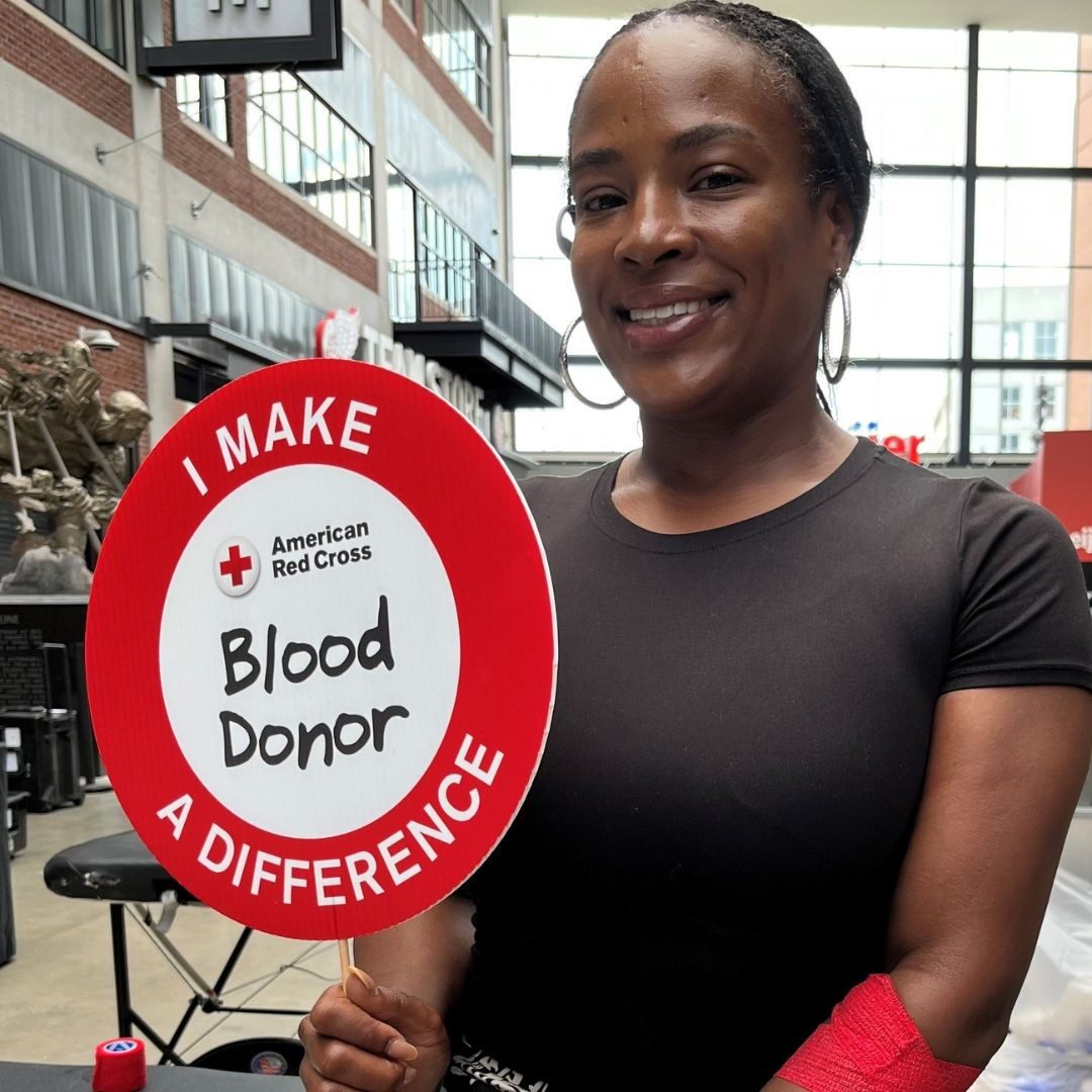 tanisha parker holding blood donor sign