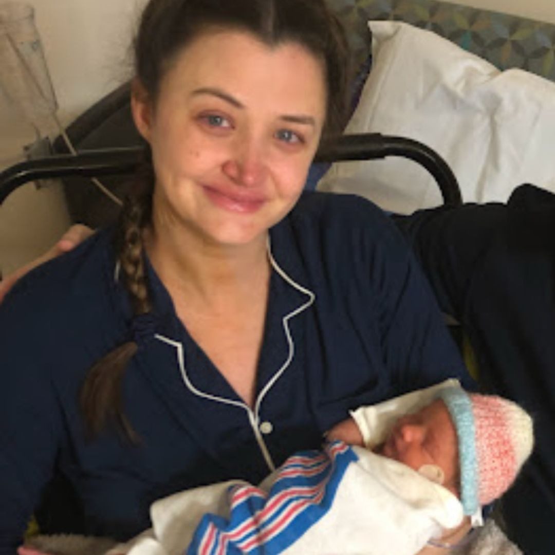 Andrea Calvaneso holding newborn baby