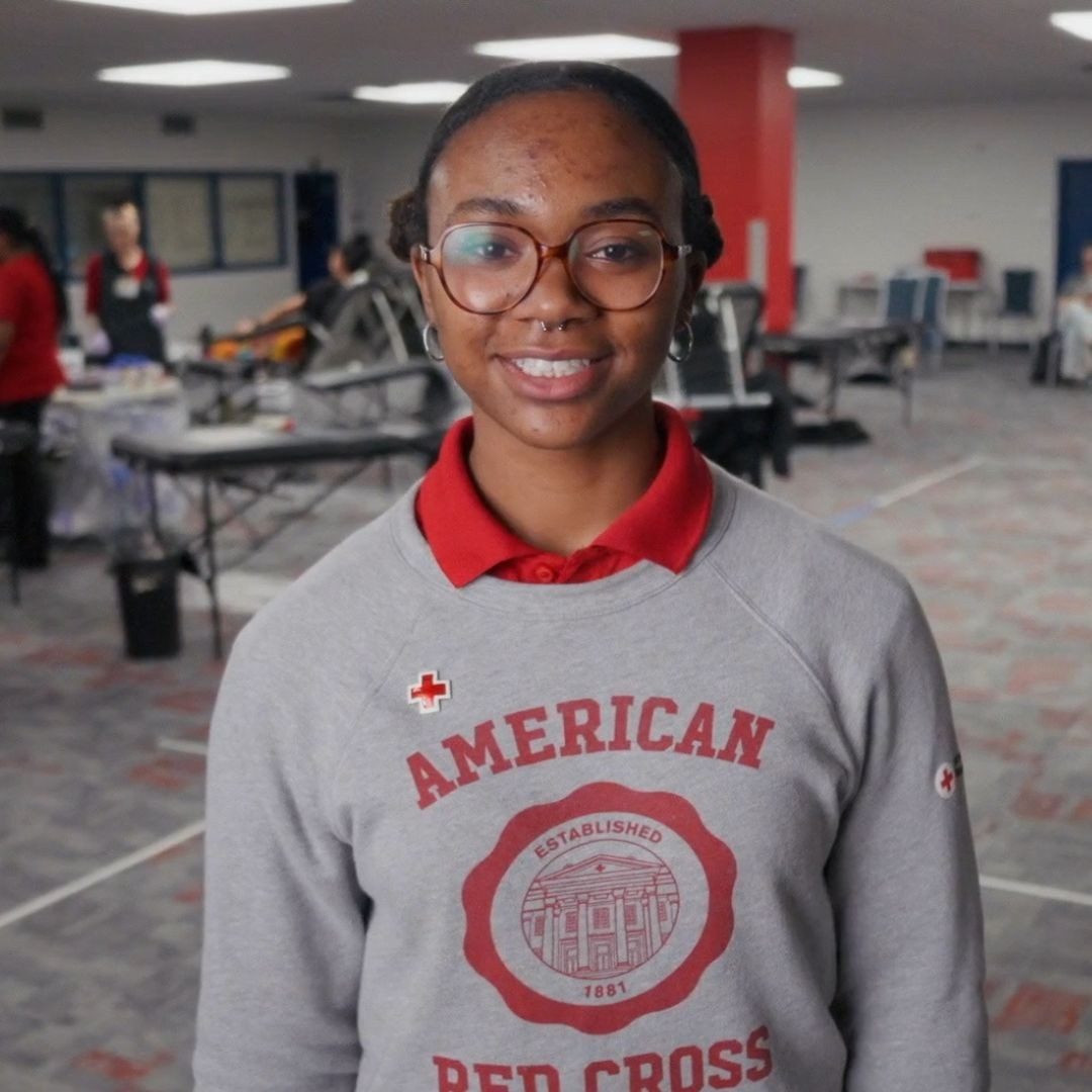 student ambassador with red cross sweater on