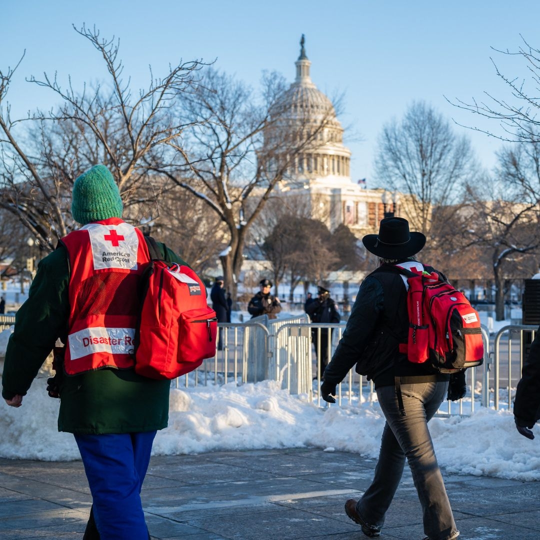 red crossers walking near capital
