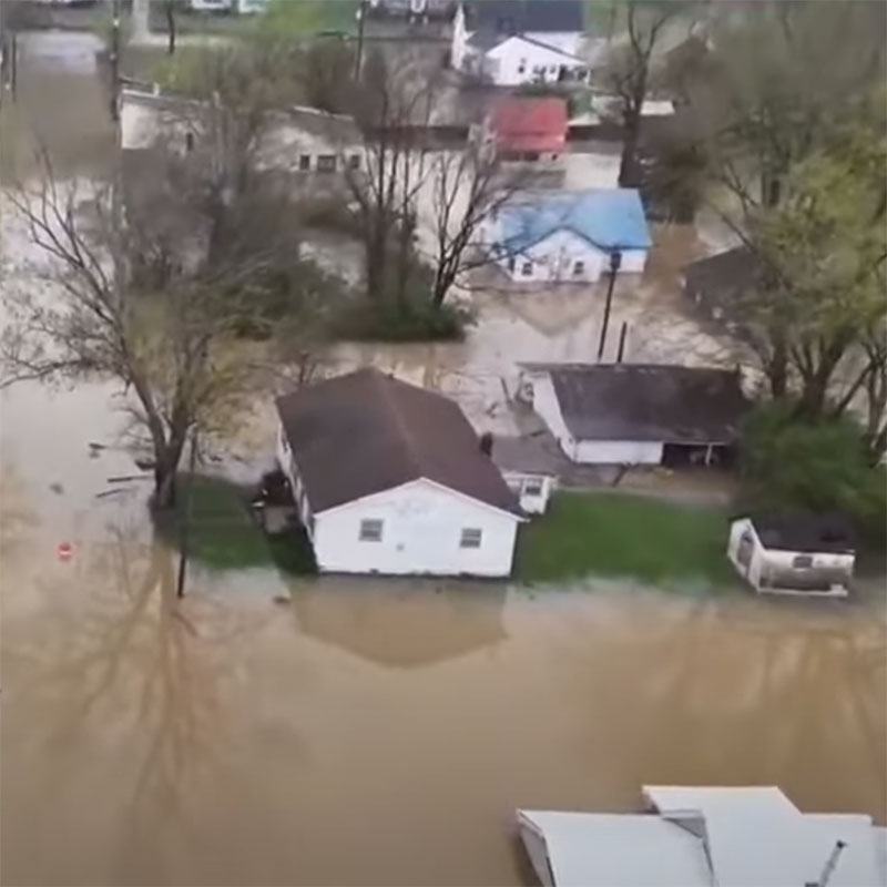 bird's-eye view of flood waters around houses.